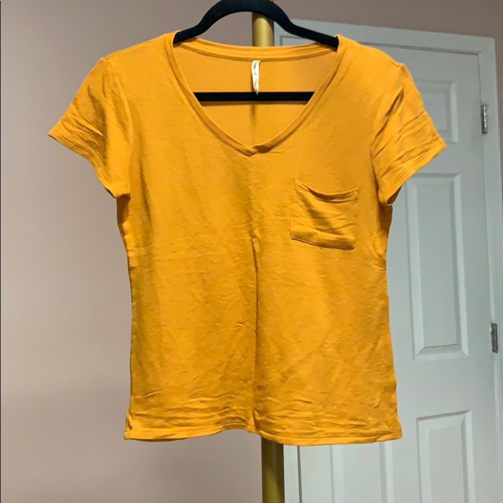yellow V-neck top with pocket